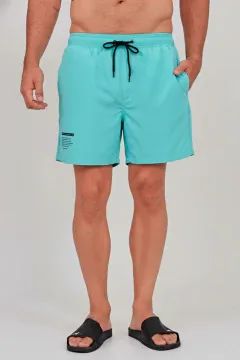 Short de baño con vivo al tono INAO aguamarina